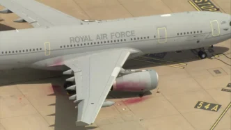 Red paint can be seen on parts of the plane