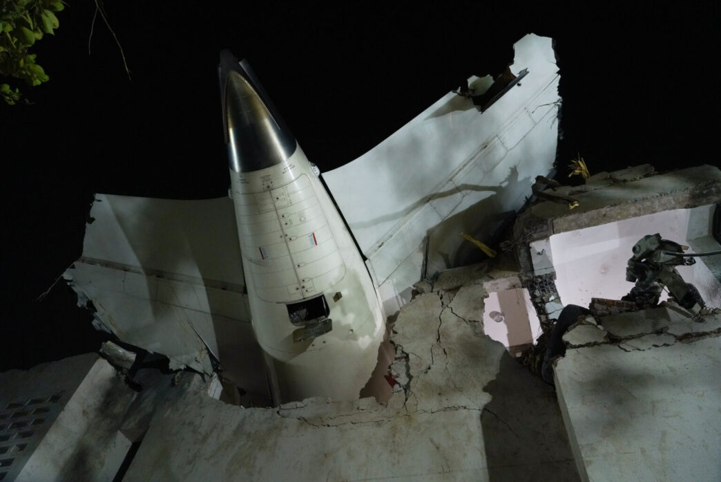 tail of air India flight 171 at crash site in Ahmedabad