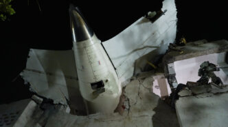 tail of air India flight 171 at crash site in Ahmedabad