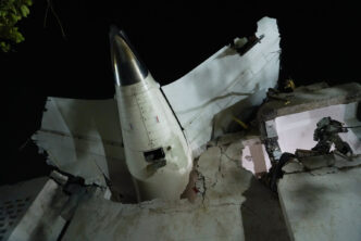 tail of air India flight 171 at crash site in Ahmedabad